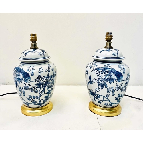 335 - TABLE LAMPS, a pair, Chinese style blue and white ceramic on gilt bases, 34cm H x 20c m W x 20cm D. ... 