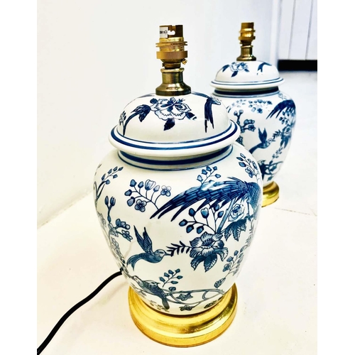 335 - TABLE LAMPS, a pair, Chinese style blue and white ceramic on gilt bases, 34cm H x 20c m W x 20cm D. ... 