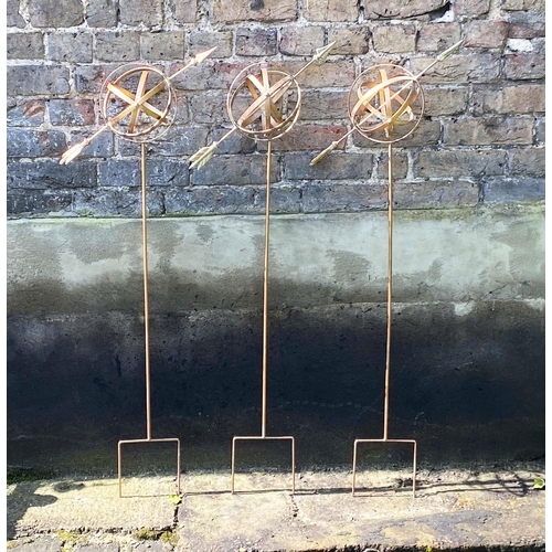 343 - GARDEN ARMILLARY STAKES, a set of three, coppered finish, 115cm H x 39cm W x 17cm D. (3)