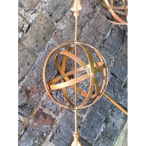 343 - GARDEN ARMILLARY STAKES, a set of three, coppered finish, 115cm H x 39cm W x 17cm D. (3)