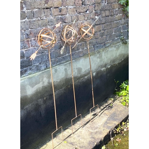 343 - GARDEN ARMILLARY STAKES, a set of three, coppered finish, 115cm H x 39cm W x 17cm D. (3)