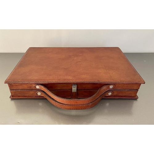 345 - TRAVELLING BACKGAMMON SET, tan leathered case, 40cm W x 23cm D x 7cm H.