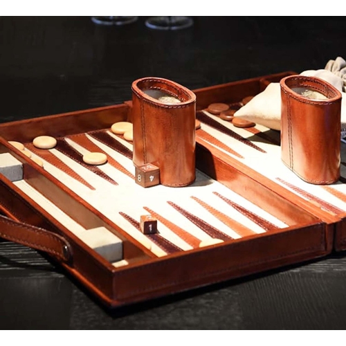 345 - TRAVELLING BACKGAMMON SET, tan leathered case, 40cm W x 23cm D x 7cm H.