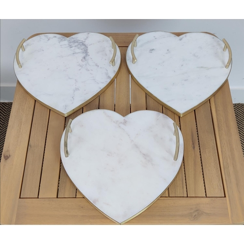 382 - HEART SHAPED TRAYS, a set of three, stone and gilt, 31cm x 31cm x 5cm approx. (3)