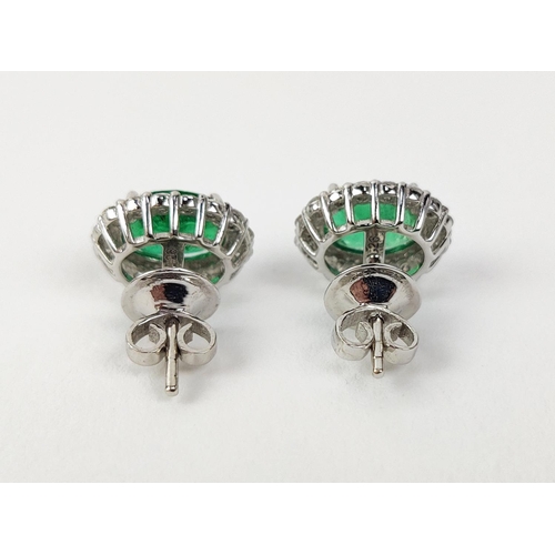 9 - A PAIR OF 18CT WHITE GOLD EMERALD AND DIAMOND STUD EARRINGS, the mixed cut emeralds of 3.20 carats i... 