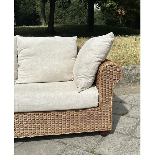 102 - CONSERVATORY TERRACE SOFA, woven cane with rounded arms and cushions, 200cm W.