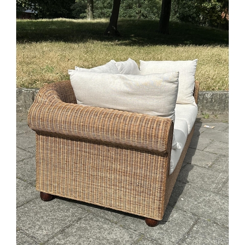 102 - CONSERVATORY TERRACE SOFA, woven cane with rounded arms and cushions, 200cm W.