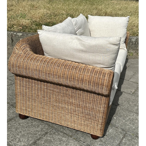 102 - CONSERVATORY TERRACE SOFA, woven cane with rounded arms and cushions, 200cm W.