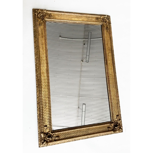 86 - WALL MIRROR, 19th century giltwood and gesso moulded rectangular with ripple moulded frame and rose ... 