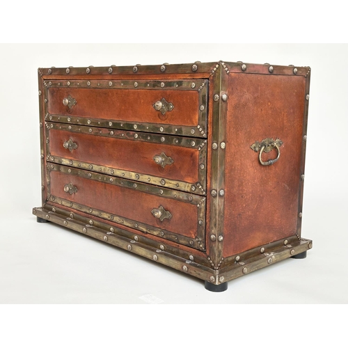 98 - CHEST, vintage hand finished leather bound and brass studded throughout with three long drawers, 90c... 