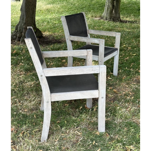 110 - GARDEN ARMCHAIRS BY PANAMA, a pair, weathered teak and all weather 'mesh' panelled, 58cm W. (2)