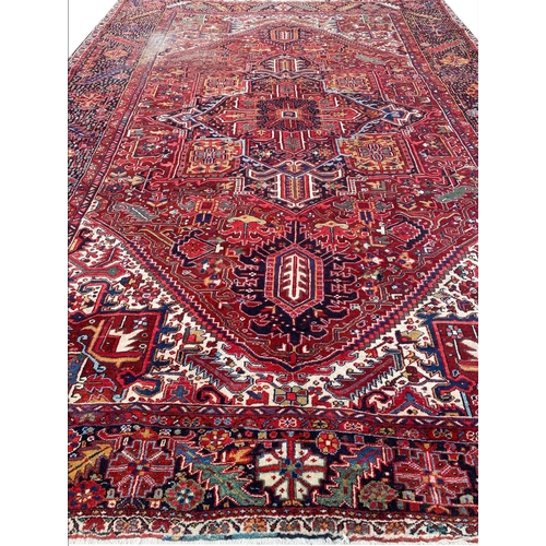 59 - ANTIQUE NORTH WEST PERSIAN HERIZ CARPET, 420cm x 300cm.