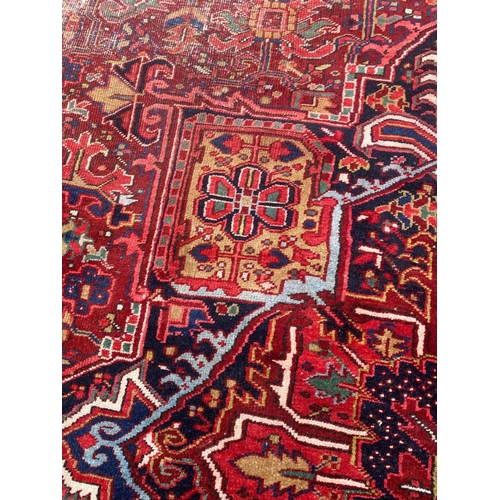 59 - ANTIQUE NORTH WEST PERSIAN HERIZ CARPET, 420cm x 300cm.