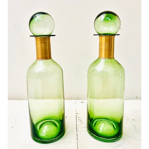 370 - DECANTERS, a pair, green glass with gilt metal collars, 52cm H x 16cm W x 16cm D. (2)