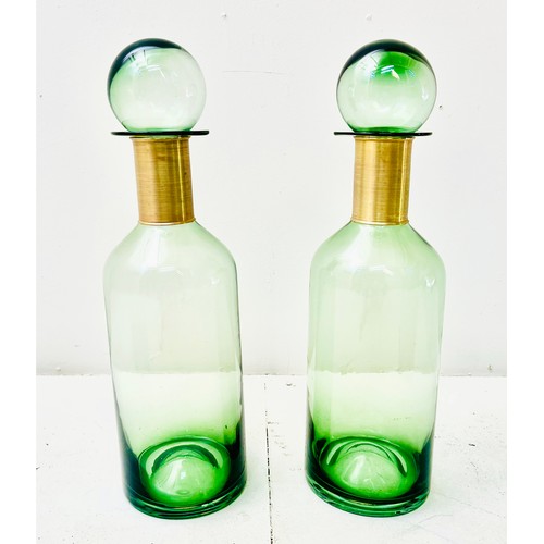 370 - DECANTERS, a pair, green glass with gilt metal collars, 52cm H x 16cm W x 16cm D. (2)