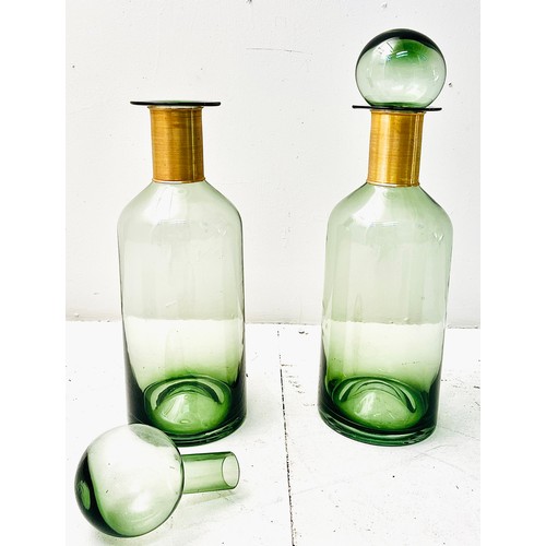 370 - DECANTERS, a pair, green glass with gilt metal collars, 52cm H x 16cm W x 16cm D. (2)