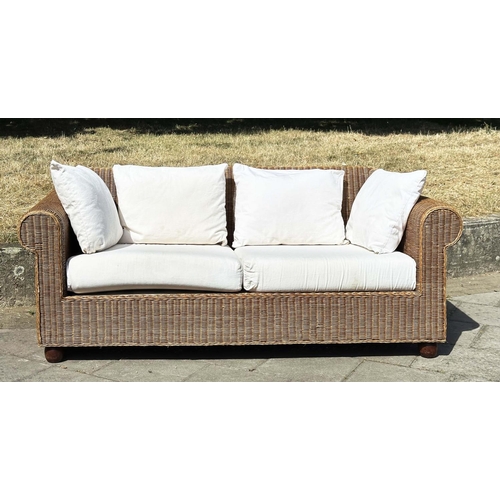 187 - CANE/CONSERVATORY SOFA, woven cane with scroll arms and linen covered cushions, 200cm W.