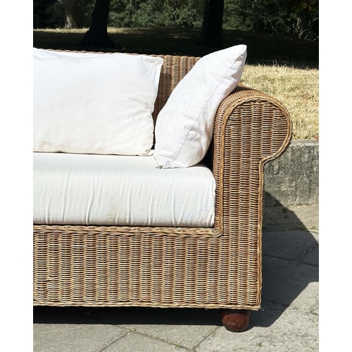 187 - CANE/CONSERVATORY SOFA, woven cane with scroll arms and linen covered cushions, 200cm W.