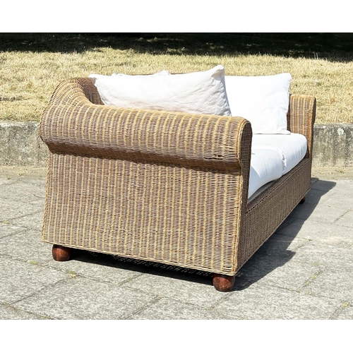 187 - CANE/CONSERVATORY SOFA, woven cane with scroll arms and linen covered cushions, 200cm W.