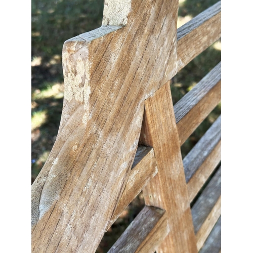 189 - LUTYENS STYLE GARDEN BENCH, well weathered teak, slatted and dowelled construction after the design ... 