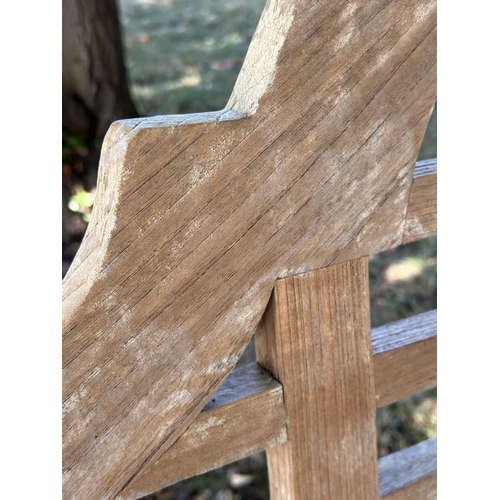 189 - LUTYENS STYLE GARDEN BENCH, well weathered teak, slatted and dowelled construction after the design ... 