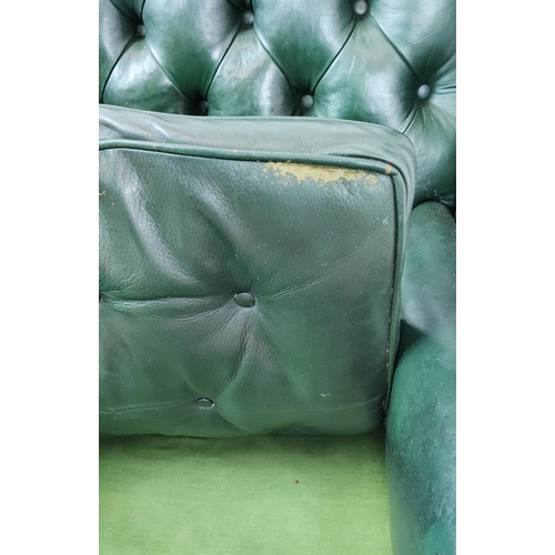 209 - A GEORGE III STYLE WING BACK ARMCHAIR, green leather, raised on cabriole legs with claw and ball fee... 