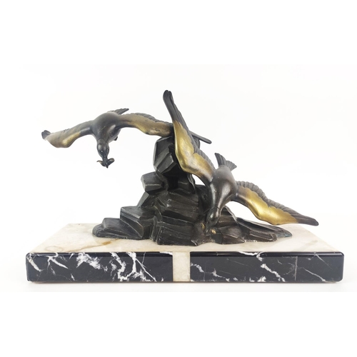 40 - ART DECO SPELTER SEAGULL FIGURE GROUP, raised on a white and black marble base, 26cm high, 51cm wide