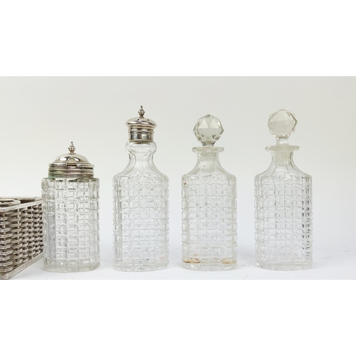 42 - A SILVER PLATED AND CUT GLASS CRUET SET, with four cut glass pieces, in a silver plated basket weave... 