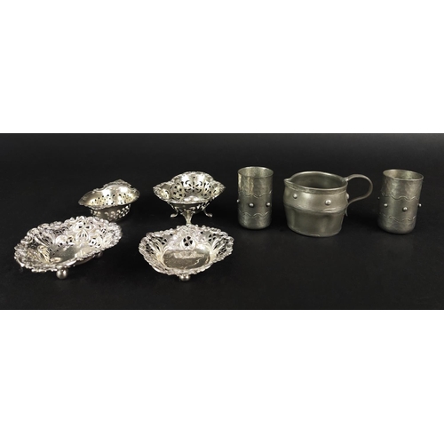 55 - SILVER SMALL DISHES, four pierced, and three items of Pewter. (7)