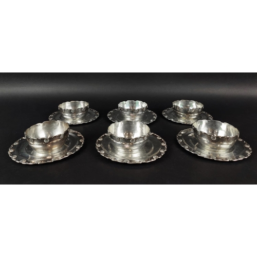 9 - A SET OF SIX WHITE METAL DESSERT BOWLS AND MATCHING STANDS, each with scalloped edges, the bowls mea... 