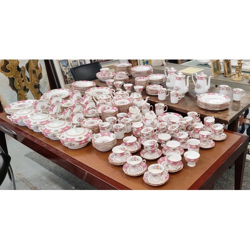 12 - A ROYAL ALBERT 'LADY CARLYLE' DINNER AND TEA SERVICE, comprising tea cups and saucers, coffee cups a... 