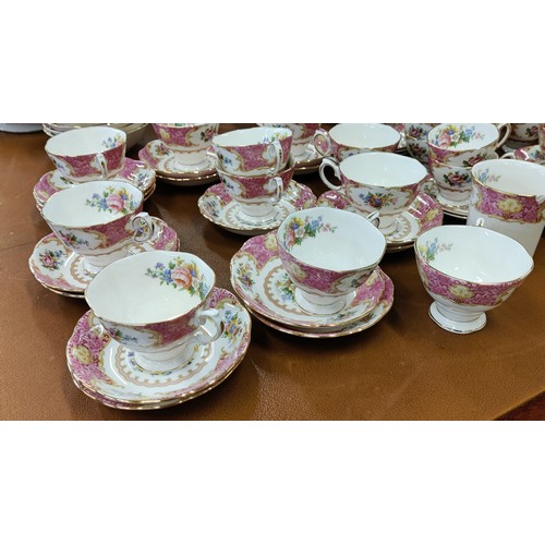 12 - A ROYAL ALBERT 'LADY CARLYLE' DINNER AND TEA SERVICE, comprising tea cups and saucers, coffee cups a... 