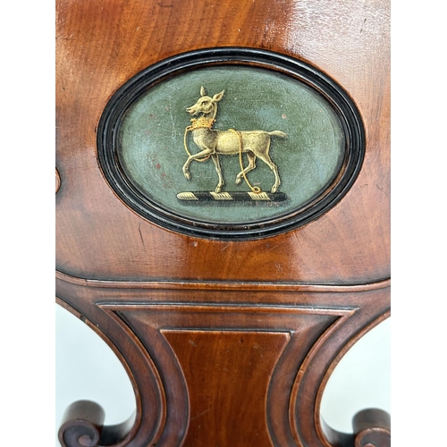 144 - HALL CHAIR, Late Regency mahogany with carved scroll back and inset painted coat of arms, 43cm W.