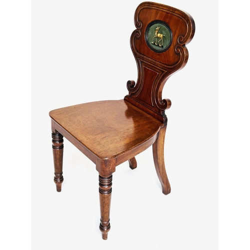 144 - HALL CHAIR, Late Regency mahogany with carved scroll back and inset painted coat of arms, 43cm W.