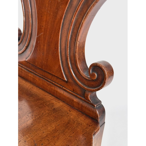 144 - HALL CHAIR, Late Regency mahogany with carved scroll back and inset painted coat of arms, 43cm W.