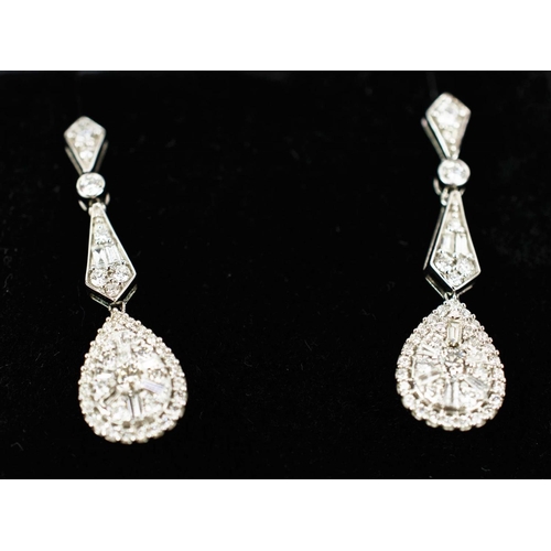 20 - A PAIR OF 14CT WHITE GOLD AND DIAMOND PENDANT EARRINGS, in the Edwardian style, set with baguette an... 