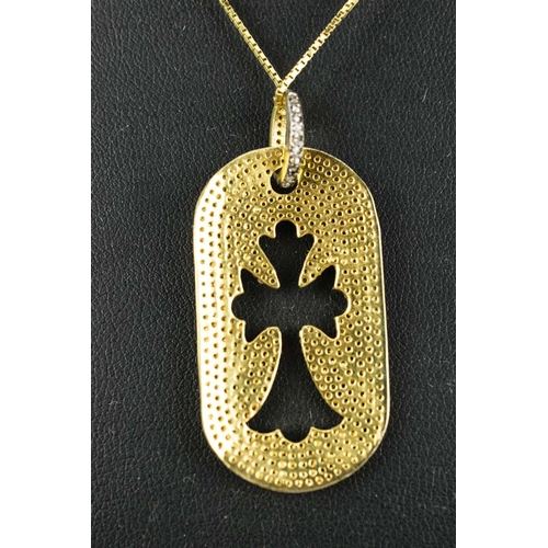 32 - A DIAMOND SET OPEN CROSS PENDANT, yellow metal on a silver-gilt chain, 46cm long, complete with box