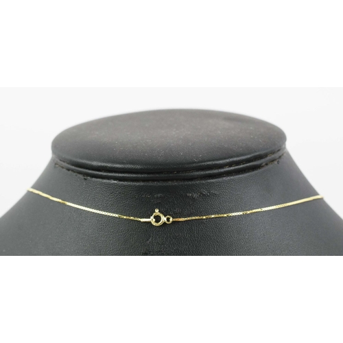 32 - A DIAMOND SET OPEN CROSS PENDANT, yellow metal on a silver-gilt chain, 46cm long, complete with box