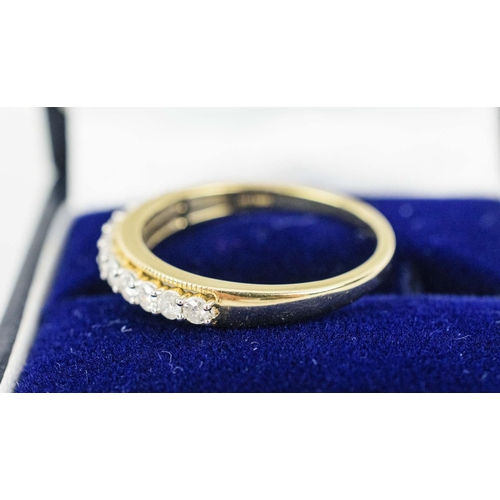 35 - A HALF ETERNITY DIAMOND RING, 9ct yellow gold, set with eleven slightly graduated round brilliant cu... 