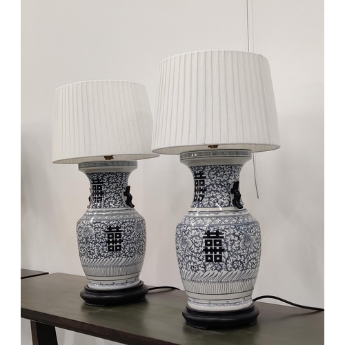 411 - TABLE LAMPS, a pair, Chinese export style blue and white ceramic, with shades, 60cm H. (2)