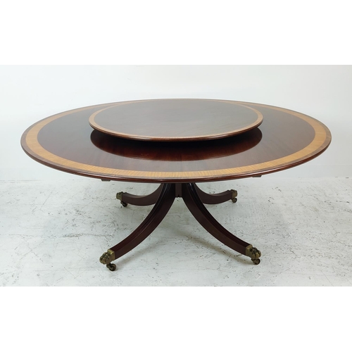 413 - DINING TABLE, Georgian style mahogany, satinwood and rosewood with circular top on brass castors, 74... 