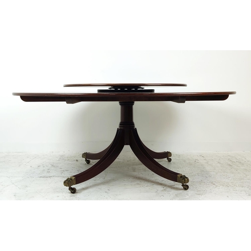 413 - DINING TABLE, Georgian style mahogany, satinwood and rosewood with circular top on brass castors, 74... 