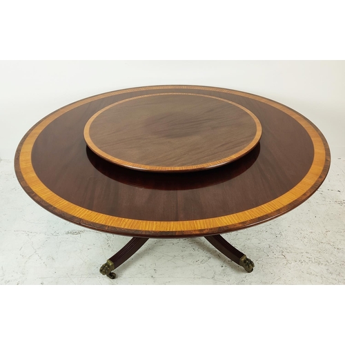 413 - DINING TABLE, Georgian style mahogany, satinwood and rosewood with circular top on brass castors, 74... 