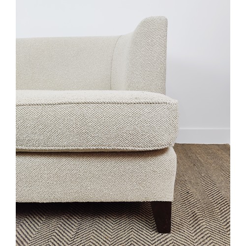 402 - SOFA, in neutral fabric with curved arms, 180cm W x 74cm H.