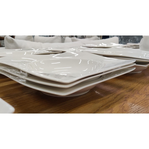 14 - A VILLEROY & BOCH NEWWAVE WHITE PART DINNER SERVICE, comprising 12 dinner plates, 12 soup plates, 12... 