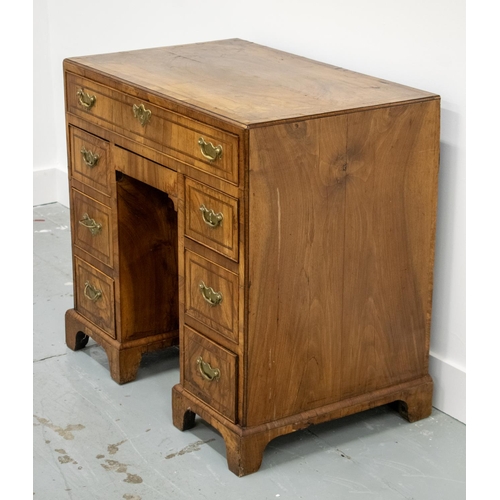 150 - KNEEHOLE DESK, George II walnut, circa 1735, with eight drawers around a recessed door, 70cm H x 78c... 