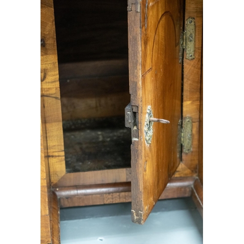 150 - KNEEHOLE DESK, George II walnut, circa 1735, with eight drawers around a recessed door, 70cm H x 78c... 