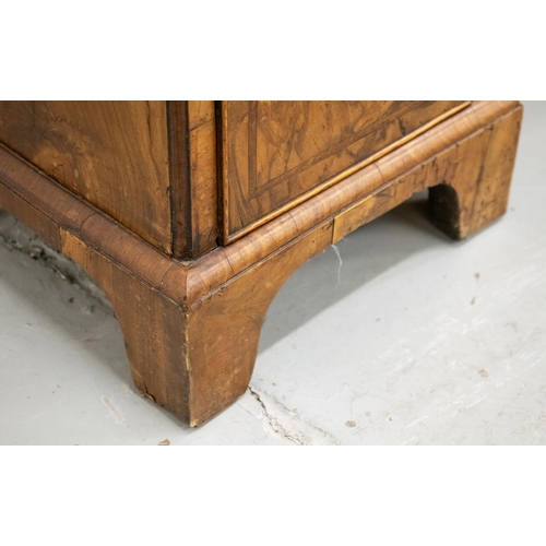 150 - KNEEHOLE DESK, George II walnut, circa 1735, with eight drawers around a recessed door, 70cm H x 78c... 