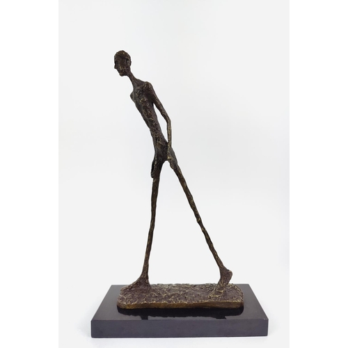 377 - CONTEMPORARY SCHOOL SCULPTURE, bronze of an elongated figure, 45cm H x 28cm L x 11cm W.