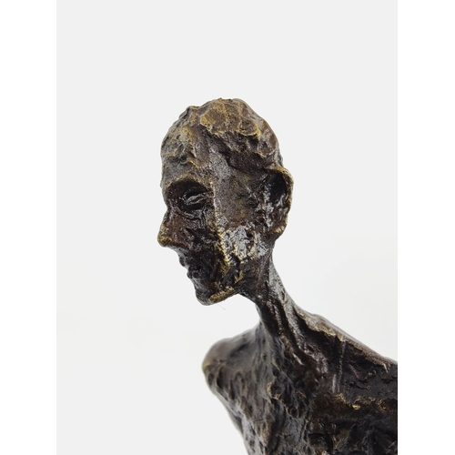 377 - CONTEMPORARY SCHOOL SCULPTURE, bronze of an elongated figure, 45cm H x 28cm L x 11cm W.